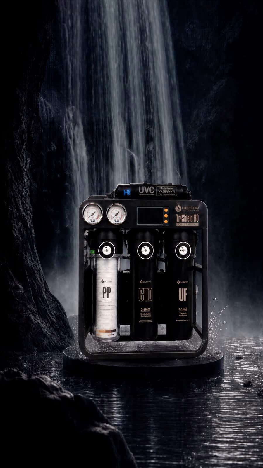 Ultima TriShield RO standing on wet rock beneath a waterfall, water breaking around the frame